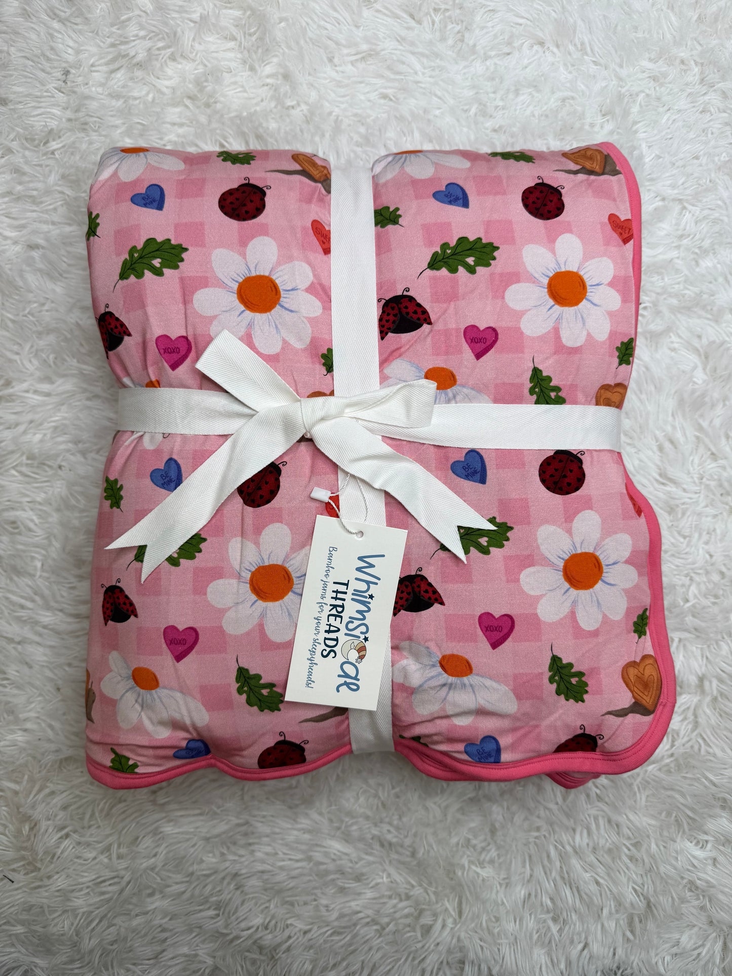 BUGS & KISSES QUILTED TODDLER BLANKET