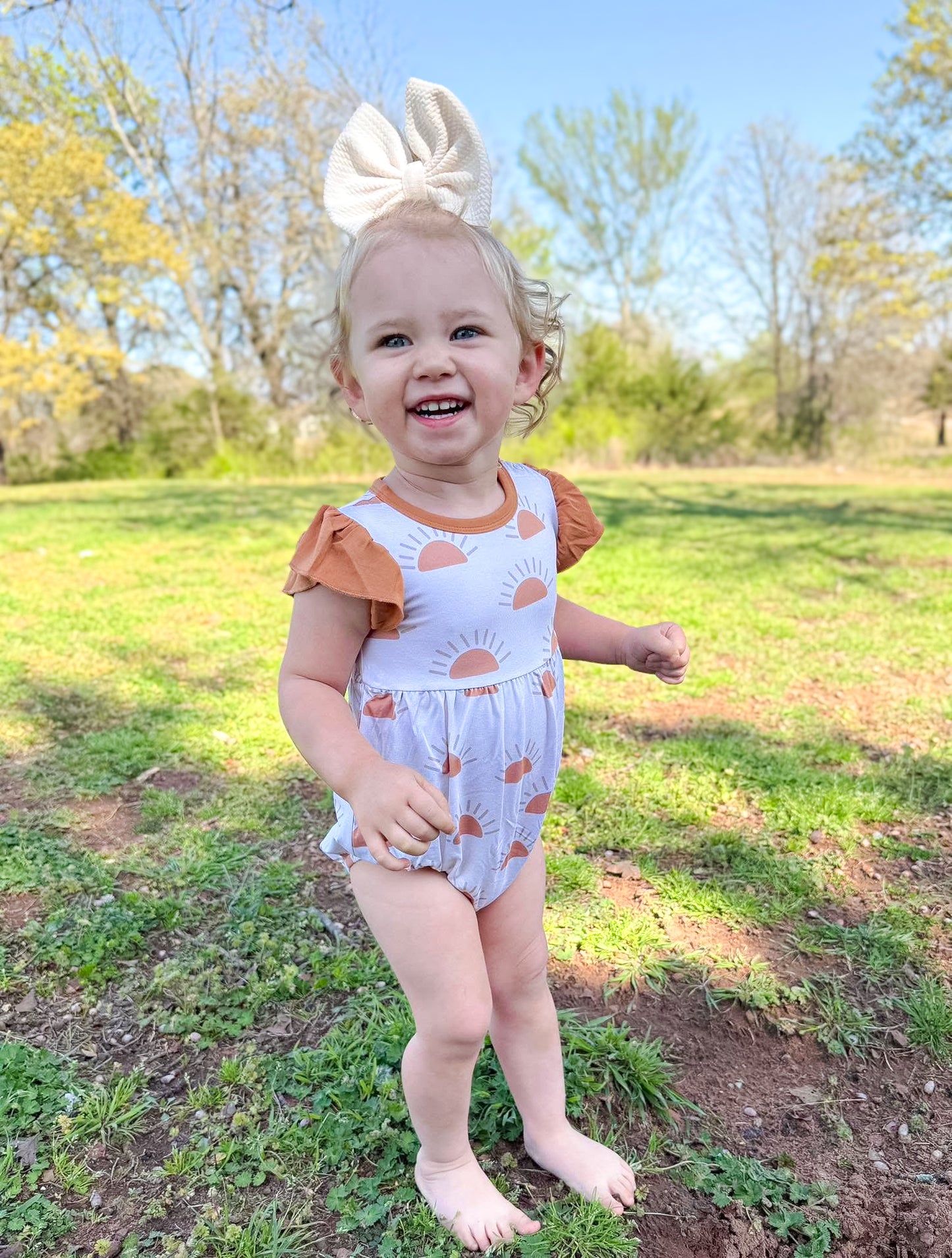 SUNSET FLUTTER BUBBLE ROMPER